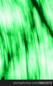 Natural green blurry defocused dynamic abstract background. Green fast speedy motion blur background.. Abstract natural green motion blurred bio backgrounds with space for lettering