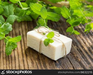Natural handmade soap with mint leaves plant