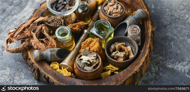 Natural herbal medicine sets on old wooden table.Chinese herbal medicine. Various kinds of herbal