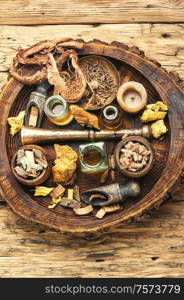 Natural herbal medicine sets on old wooden table. Natural herbs medicine