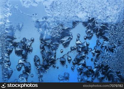 Natural ice pattern on winter glass, closeup texture