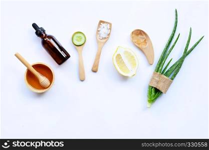Natural ingredients for homemade skin care on white.