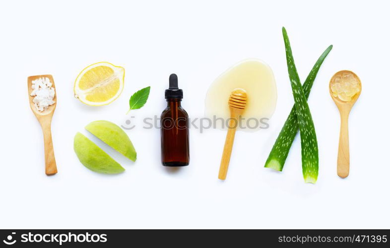 Natural ingredients for homemade skin care on white background.