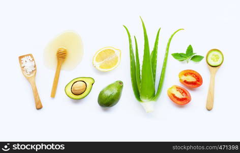 Natural ingredients for homemade skin care on white background.