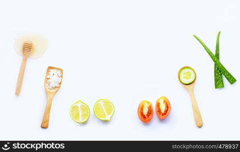 Natural ingredients for homemade skin care on white background.