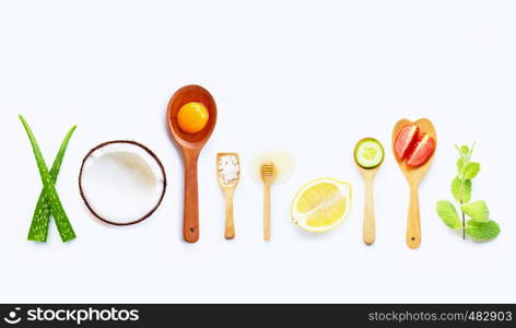 Natural ingredients for homemade skin care on white background.