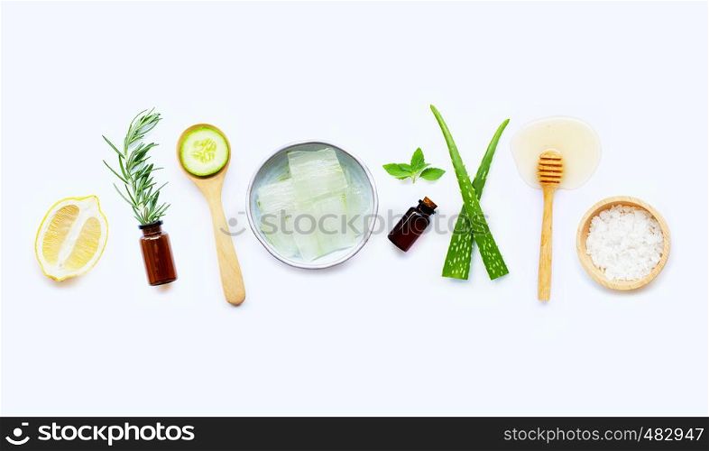 Natural ingredients for homemade skin care on white background.