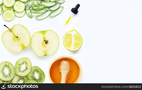 Natural ingredients for homemade skin care on white background.