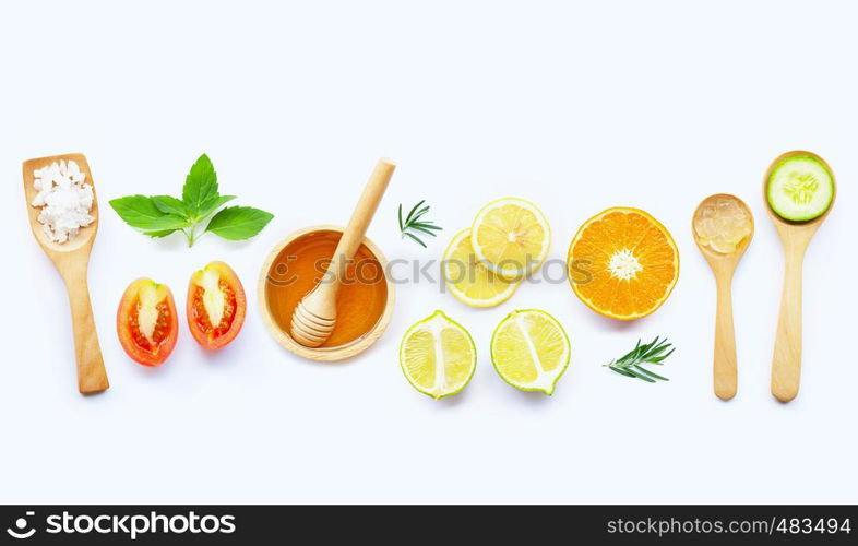 Natural ingredients for homemade skin care on white background.