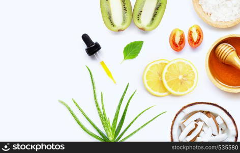 Natural ingredients for homemade skin care on white background.