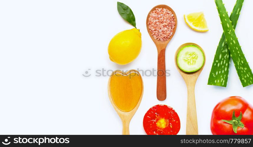 Natural ingredients for homemade skin care on white background.