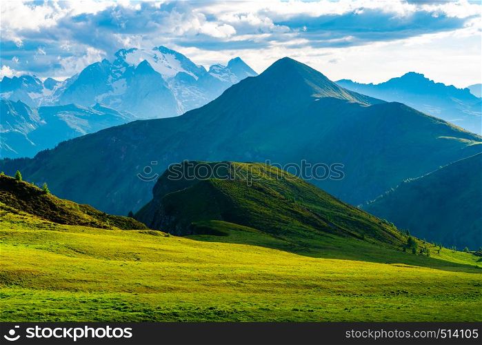 Natural landscape of beautiful mountains with the green hill and the field of f;owers at Giau Pass in Belluno Italy