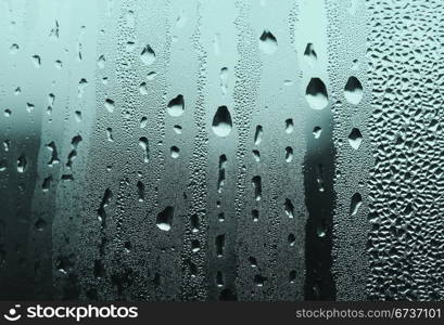 natural large and fine water drops on glass