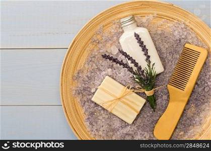 Natural lavender cosmetic products with comb on wooden tray