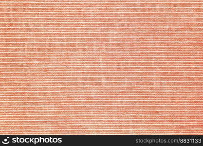 Natural linen texture as background. Cotton fabric with orange and white line striped pattern, texture close up, top vies, flat lay. Backdrop, wallpaper. Matereal for clothes, curtain and upholstery