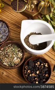 Natural medicine, herbs, mortar, natural colorful tone