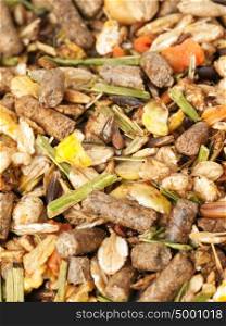 natural muesli background with herbs. for horse. macro