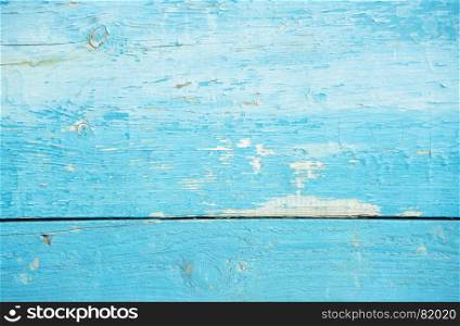 Natural old wooden background: blue tree cracking texture with paint flaking and uneven painted