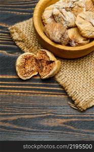 natural organic dried figs isolated on wooden background. dried figs isolated on wooden background