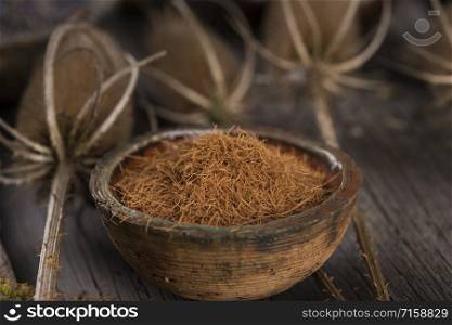 Natural remedy and wooden table background