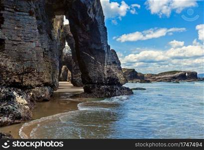 Natural rock arches on Cathedrals beach  in low tide  Cantabric coast, Lugo  Galicia , Spain .