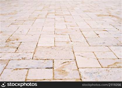 Natural sandstone paving slabs, selective focus. Natural natural stone for interior and renovation. Arrangement of sidewalks and roads