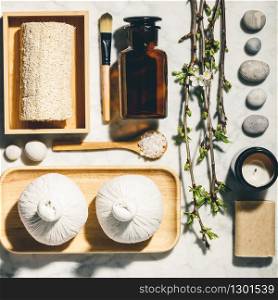 Natural skin care products with spring cherry branches flat lay. Zero waste, eco friendly bathroom and spa accessories