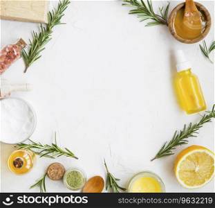 Natural skincare ingredients with manuka honey, lemon, essential oil, clay, balm, rosemary herbs and natural soap, healthy wellness and spa products , natural and homemade ingredients with copy space top view