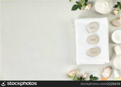 Natural SPA composition and zen stones with words Soul, Body, Relax, flat lay, copy space