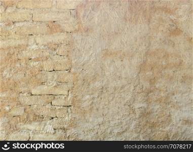 Natural wall texture of cob house for background. It is a natural building material made from subsoil, water and straw fibrous organic material.