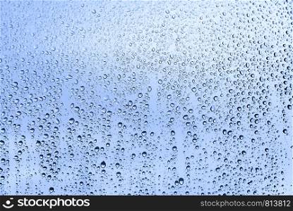 Natural water drops on glass, closeup texture