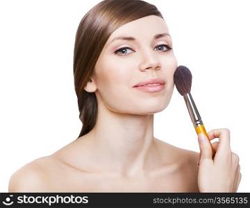 natural woman with cosmetic brush on face on white background