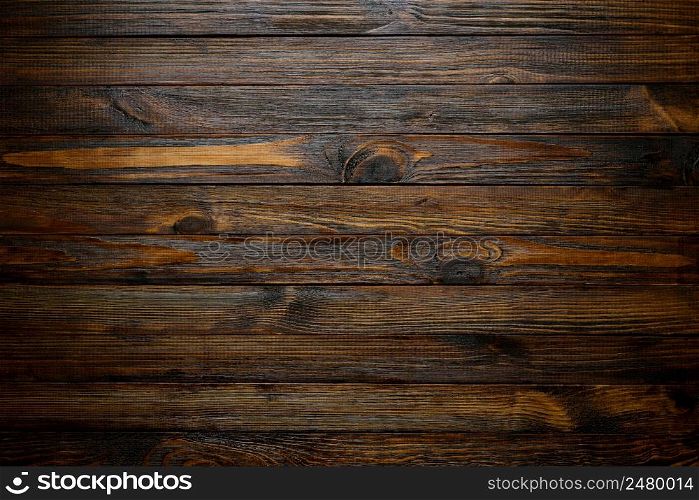 Natural wood texture. Wood background. Dark rustic planks table top flat lay view.