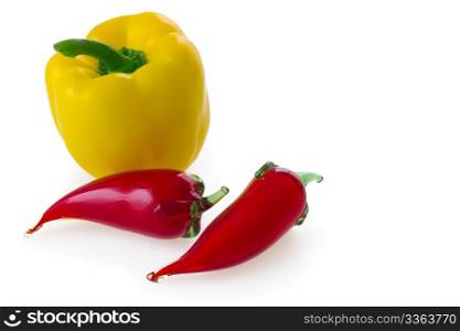 Natural yellow bell pepper and two glass red chili (chilli, chilly, chile) pepper isolated on white background.