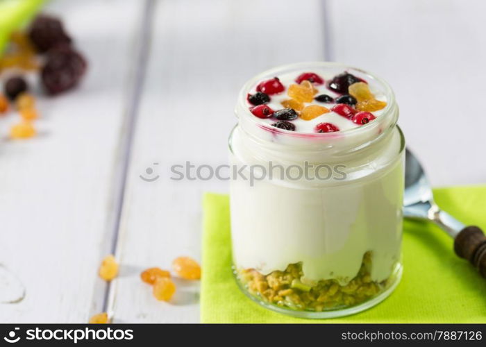 Natural yogurt with fresh berries and grains