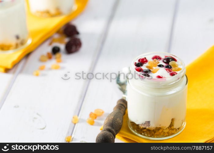 Natural yogurt with fresh berries and grains