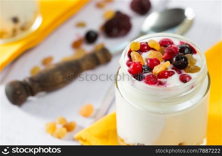 Natural yogurt with fresh berries and grains