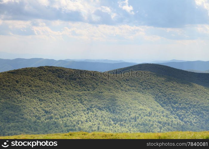 Nature and environment. Beautiful green hills. Mountain landscape in the summer. Travel and tourism.