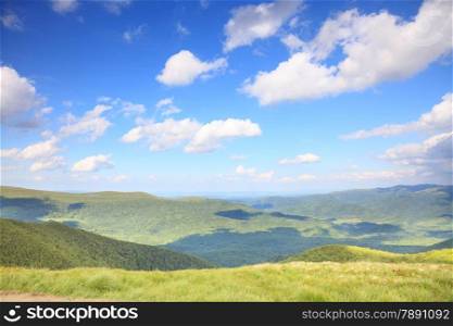 Nature and environment. Fields and hills. Mountain landscape in the summer. Travel and tourism.