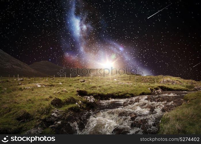 nature and landscape concept - landscape of over farmland or country river over night sky or space with shooting stars and galaxy background. landscape over space and galaxy in night sky