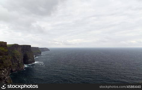 nature and landscape concept - view to cliffs of moher and atlantic ocean in ireland. cliffs of moher and atlantic ocean in ireland