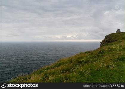 nature and landscape concept - view to cliffs of moher with OBriens Tower and atlantic ocean in ireland. cliffs of moher and atlantic ocean in ireland