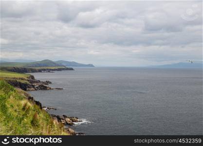 nature and landscape concept - view to ocean at wild atlantic way in ireland. view to ocean at wild atlantic way in ireland