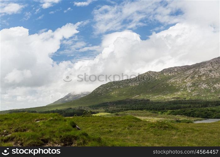 nature and landscape concept - view to plain and hills at connemara in ireland. view to plain and hills at connemara in ireland