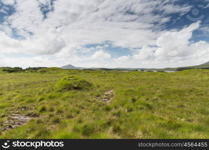 nature and landscape concept - view to plain with lake or river at connemara in ireland. view to plain and lake at connemara in ireland