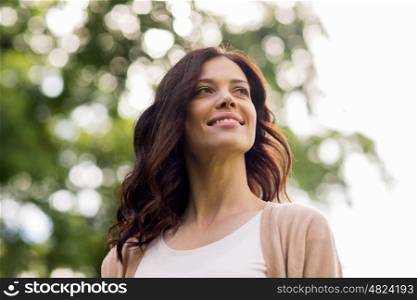 nature and people concept - beautiful happy young woman outdoors at summer. beautiful happy young woman outdoors at summer
