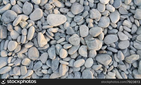 Nature background from gray sea pebbles