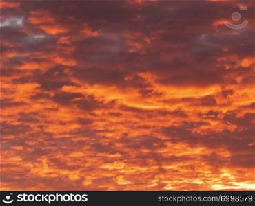 Nature concept - beautiful sunset or sunrise clouds - orange sky background.. Sunrise clouds - orange sky background.