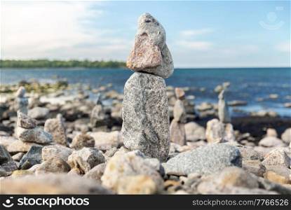 nature, harmony and balance - close up of stone pyramids or towers on beach. close up of stone pyramids or towers on beach