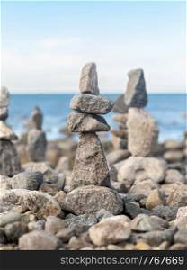 nature, harmony and balance - close up of stone pyramids or towers on beach. close up of stone pyramids or towers on beach